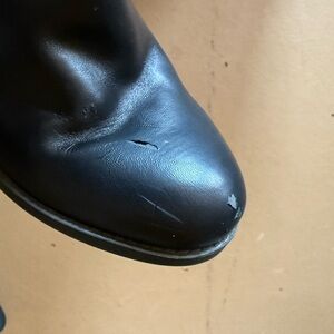 NWOT- small scuff on boot, easy buff out. Never worn comfortable cushioning.